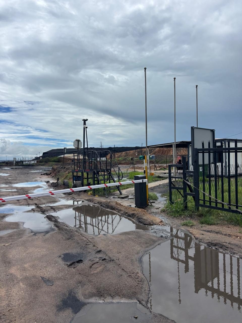 Site access control and boom gate at a mine haul road under construction
