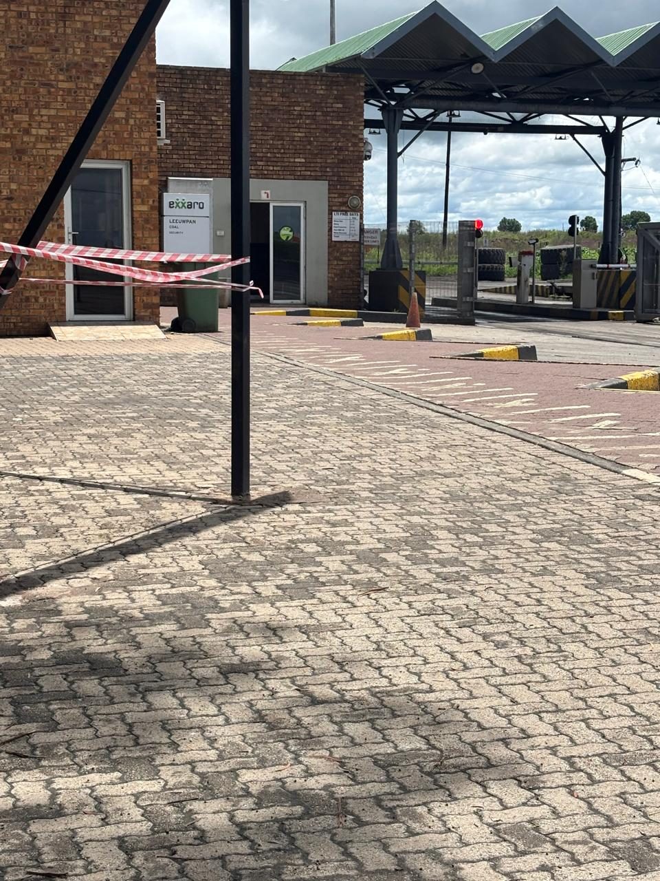 Paved access road and weighbridge canopy at a colliery entrance
